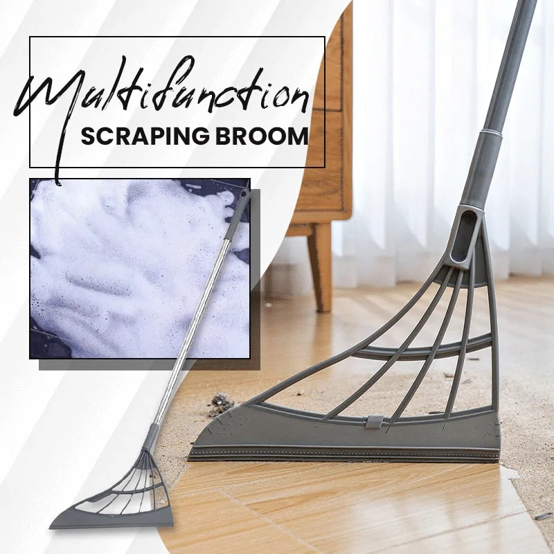 Image of a long gray scraping broom with silicone end, scraping up debris from a hardwood floor.