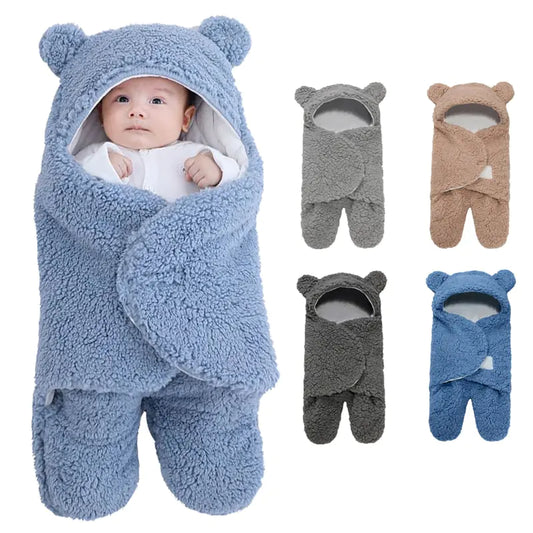 A picture of a baby inside of the bear shaped light blue fleece footed sleeping bag with ears.  On the right, pictures of the baby sleeping bag in light gray, tan, dark gray, and blue.