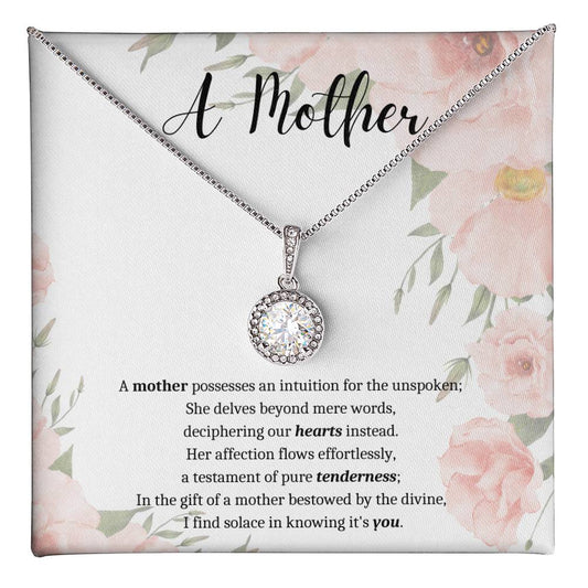 White message card with pink floral background. A Mother poem. Silver necklace with round cubic zirconia pendant.