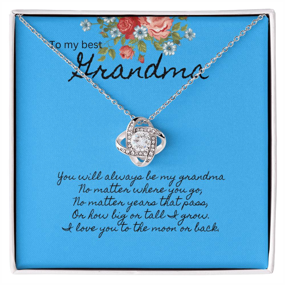 Blue message card with floral bouquet at the top.  Message To my best Grandma. Silver necklace with cubic zirconia pendant.