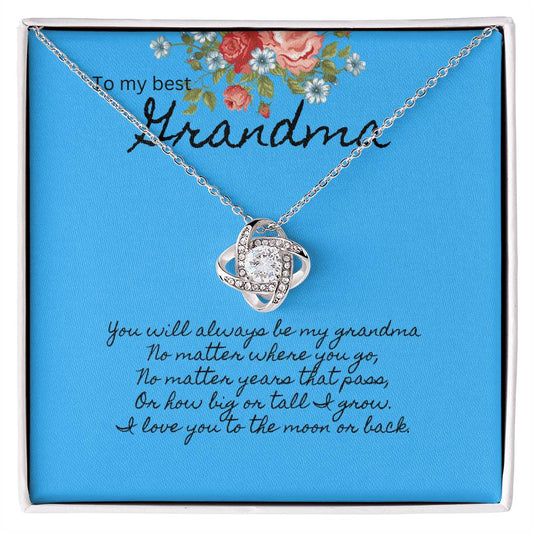 Blue message card with floral bouquet at the top.  Message To my best Grandma. Silver necklace with cubic zirconia pendant.