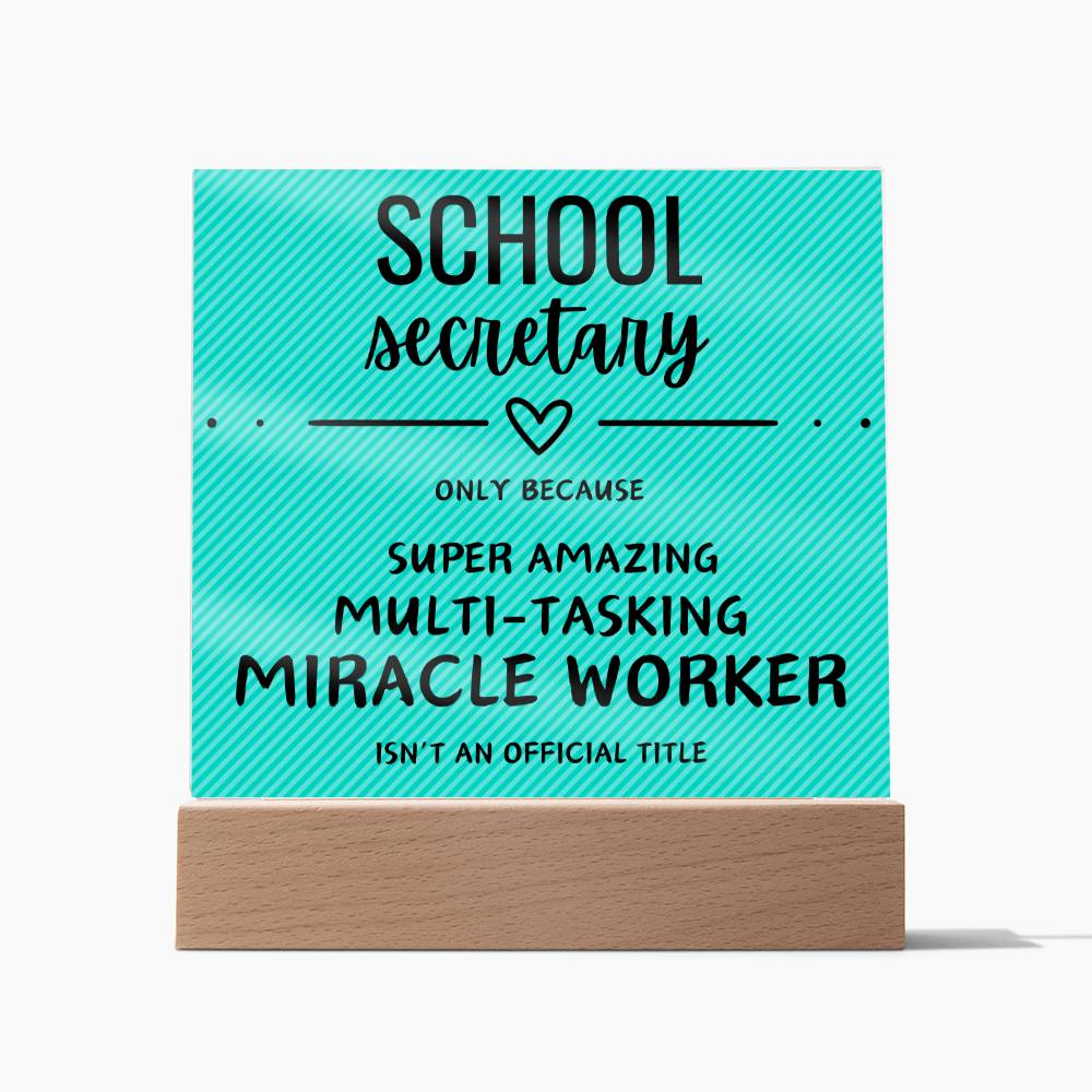 Square acrylic plaque with textured teal background.  School secretary description. In wooden base.