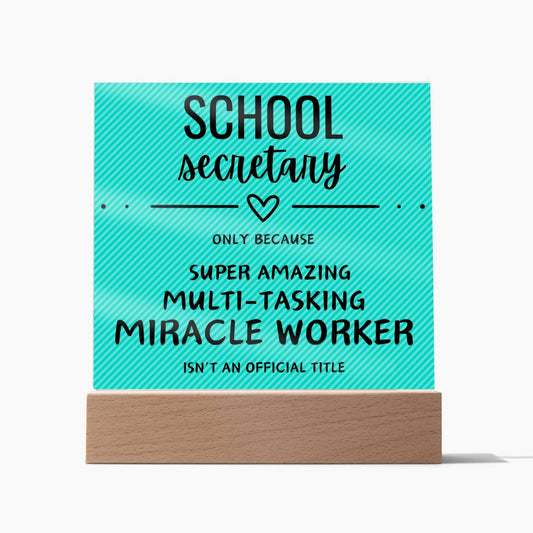 Square acrylic plaque with textured teal background.  School secretary description. In wooden base.